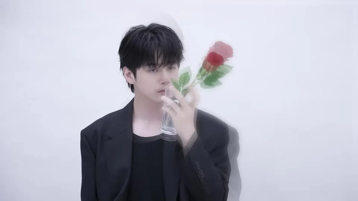 Ong Seong-wu gazes at a glass vase filled with roses in the 2026 Official Membership Kit teaser video