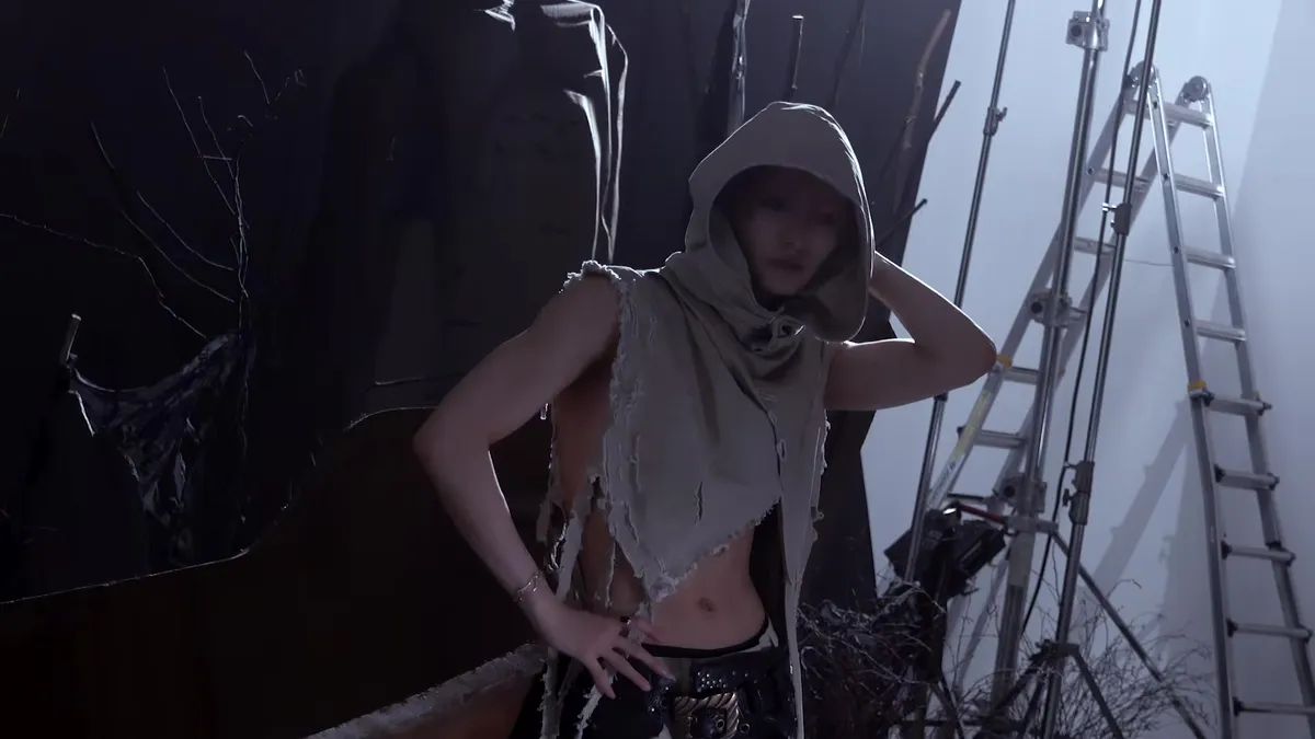 An All Hours member wearing a hoodie poses in a pirate-themed outfit.