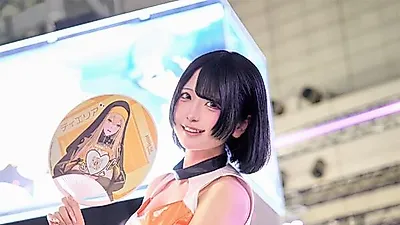 Model Kino shines in orange at the Miraesi booth during TGS 2026
