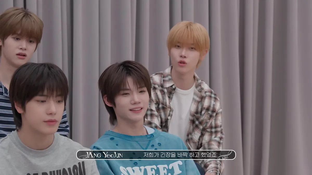 Members of Close Your Eyes sharing a conversation in front of a curtain