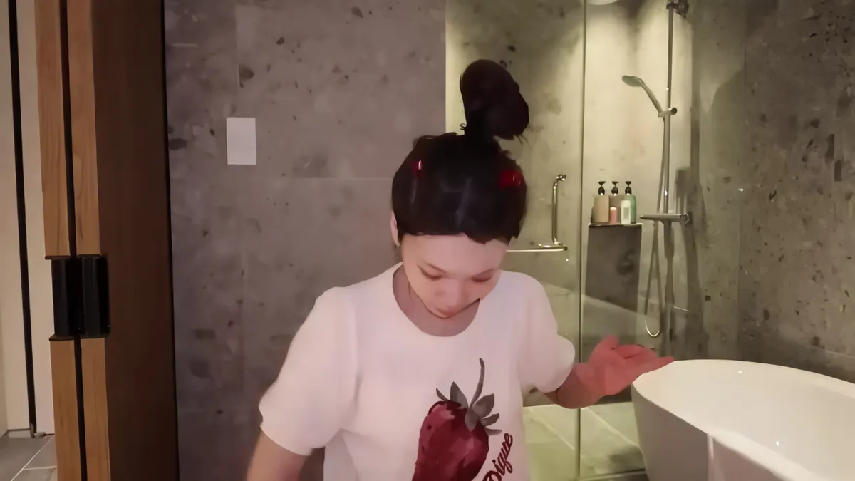 Chaewon Prepares for Her Nighttime Skincare Routine in the Bathroom