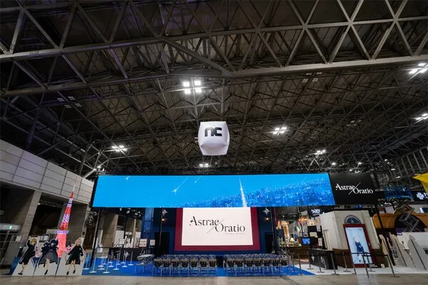 A view of the massive NCSoft booth at TGS 2026, featuring a Tokyo Tower model representing 1989 Tokyo