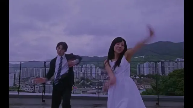 Soyeon's Scene in 'I'm Quitting' Music Video Wearing a White Dress