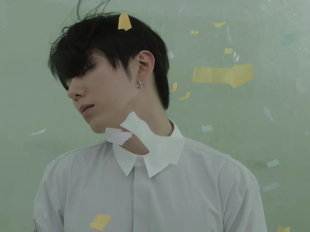 Kihyun's EP The Phase Trailer Features a Scene of Him Bowing His Head Amidst Scattering Paper Scraps