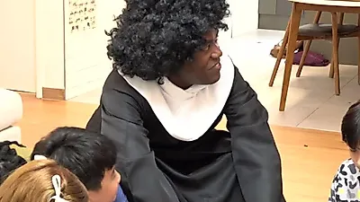 Jonathan transforms into choir conductor for 'Ensemble' campaign