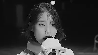 IU captures the lingering traces of heartbreak in 'From This Star (Unknown Planet)' live clip