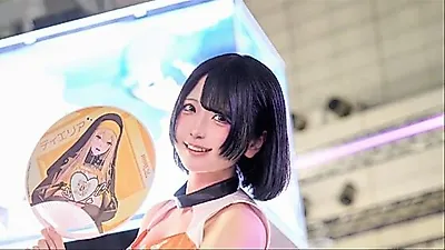 Model Kino shines in orange at the Miraesi booth during TGS 2026