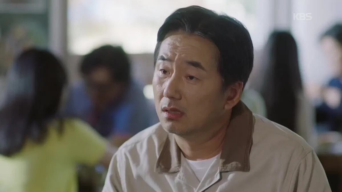 A man staring intently with a facial expression.