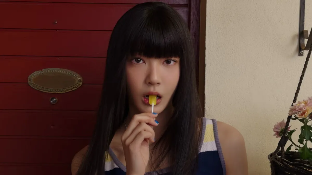 A person looks into the camera in TUIDE's 'SUN KISS' music video teaser