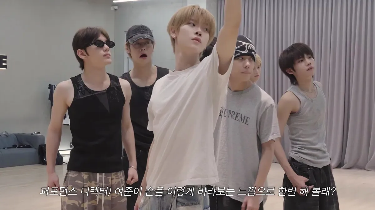 Figures practicing choreography in a dance studio