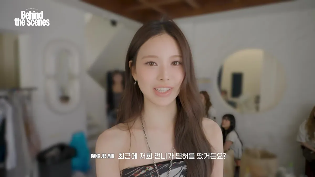 A member of izna smiling toward the camera
