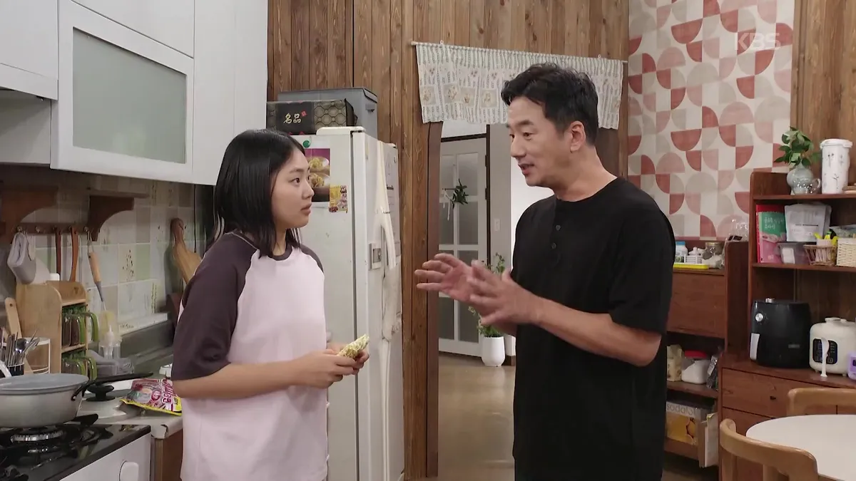 Lee Ju-yeon stares at her counterpart in a restaurant